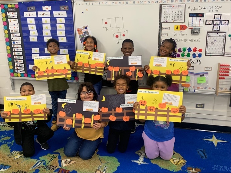 Miss Sarmiento’s 1st grade class is proudly showing off their Five Little Pumpkins art projects.