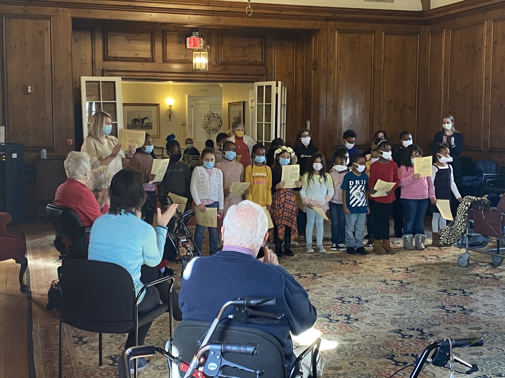 Students recite a poem for the residents.